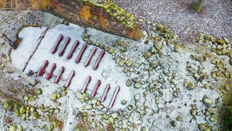 aerial view of old church ruins with red seats, stone from walls on ground