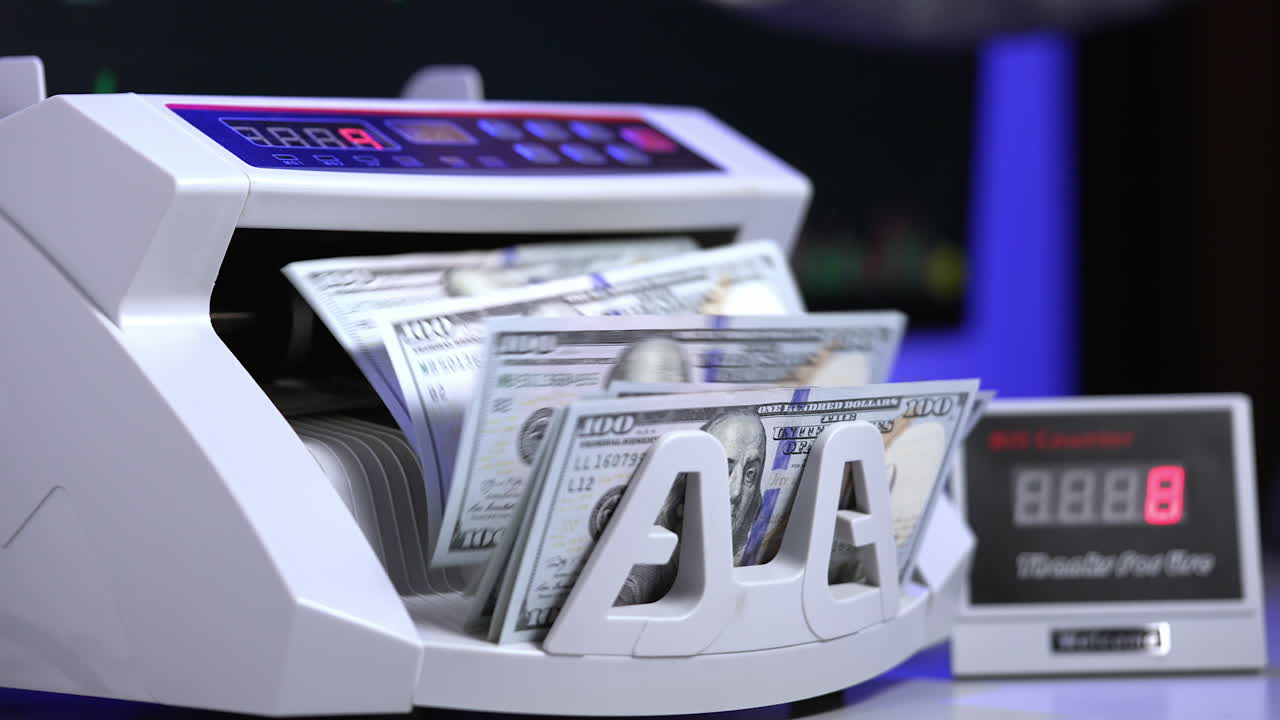 Counting operation on electronic cash machine. Counting money on bank automatic equipment. Paper banknotes in modern money counting machine. Investment capital operations.