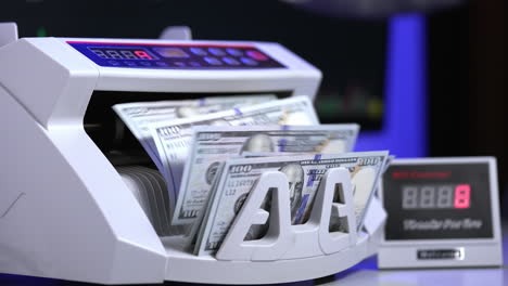 counting operation on electronic cash machine. counting money on bank automatic equipment. paper banknotes in modern money counting machine. investment capital operations.