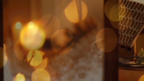 animation of lit christmas candles and glowing spots of light