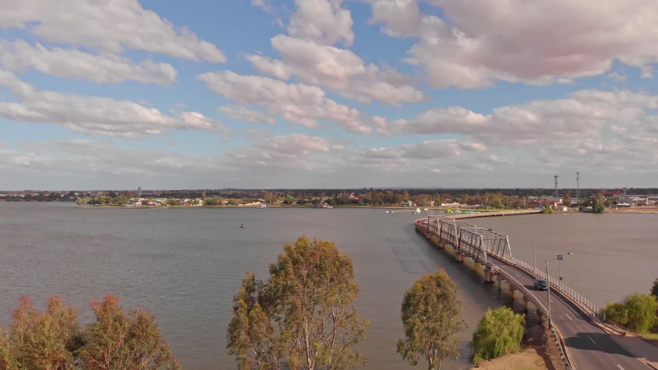 Over trees to the Yarrawonga Mulwala bridge with Yarrawonga in the background