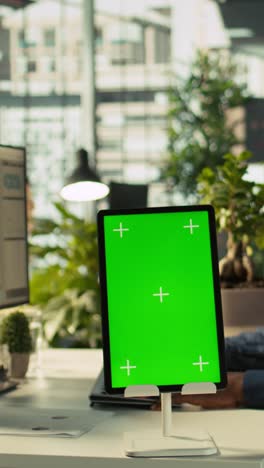 vertical video close up of isolated screen tablet used by worker in office
