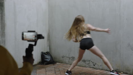 dancing-woman-young-caucasian-freestyle-dancer-performing-for-friend-using-smartphone-taking-video-enjoying-sharing-hip-hop-dance-on-social-media