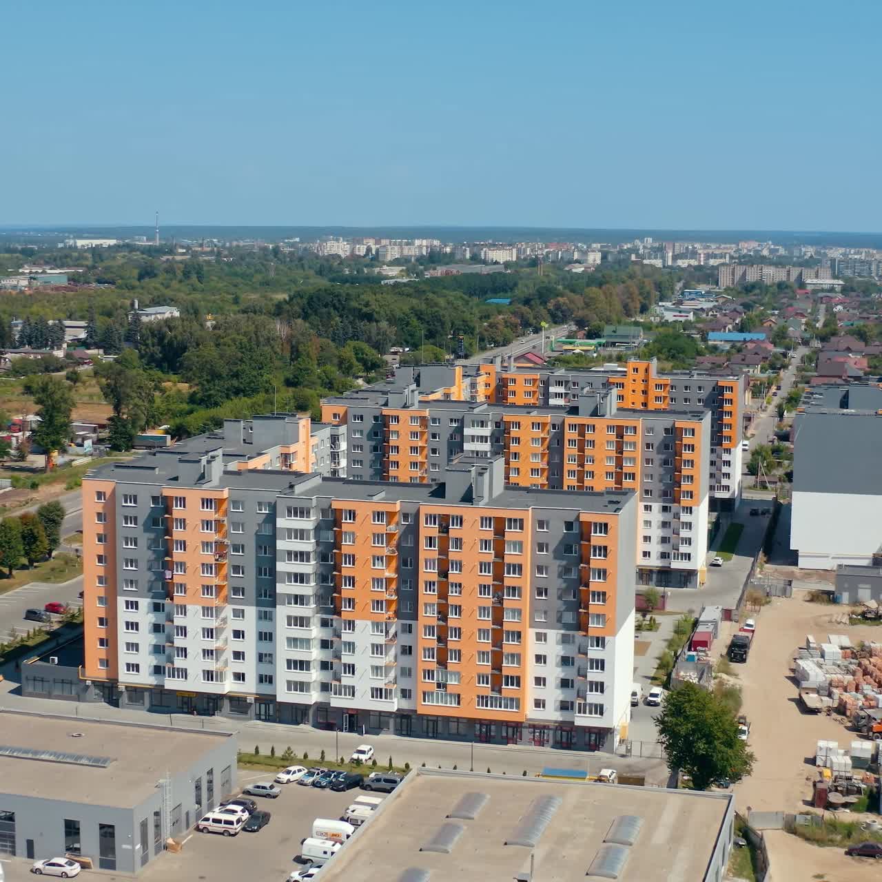 Construction of new residential buildings. Modern complex of bright block of flats built in the outskirts of the city. Apartment houses. Aerial view