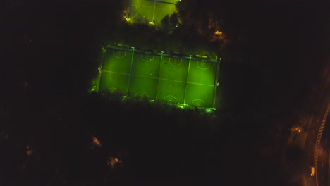 night aerial view of illuminated soccer fields