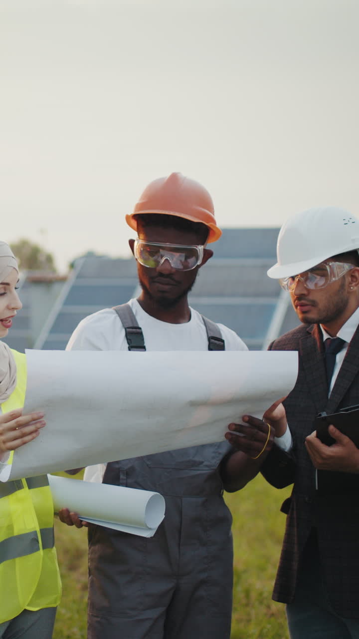 Engineers reviewing solar panel plans
