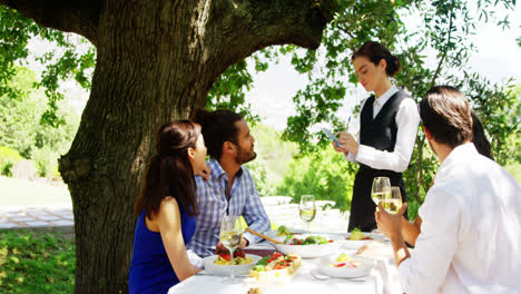 waitress taking an order from couples