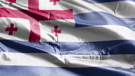 la bandera textil de ajaria se agita lentamente en el bucle del viento. la bandera adjariana se balancea suavemente en la brisa. el tejido textil de la tela. el fondo de relleno completo. bucle de 20 segundos.
