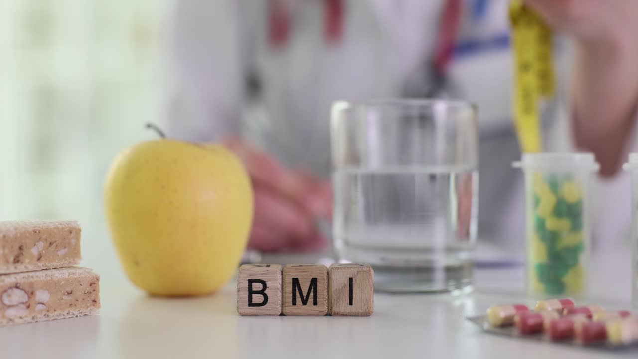 Doctor's desk with BMI blocks, healthy food, and supplements, indicating a focus on health and nutrition