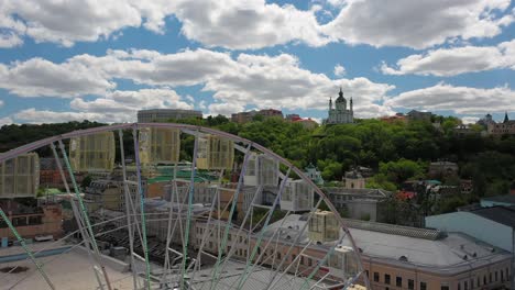 aerial view of city with ferris wheel and church