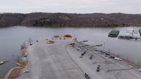 Trucks pulling boats at marina boat ramp