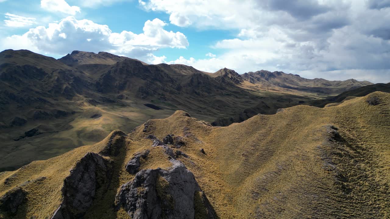 4K cinematic aerial pass over Peru’s rugged Andes. Golden slopes and drifting smoke combine to reveal the balance of agriculture, nature, and fire