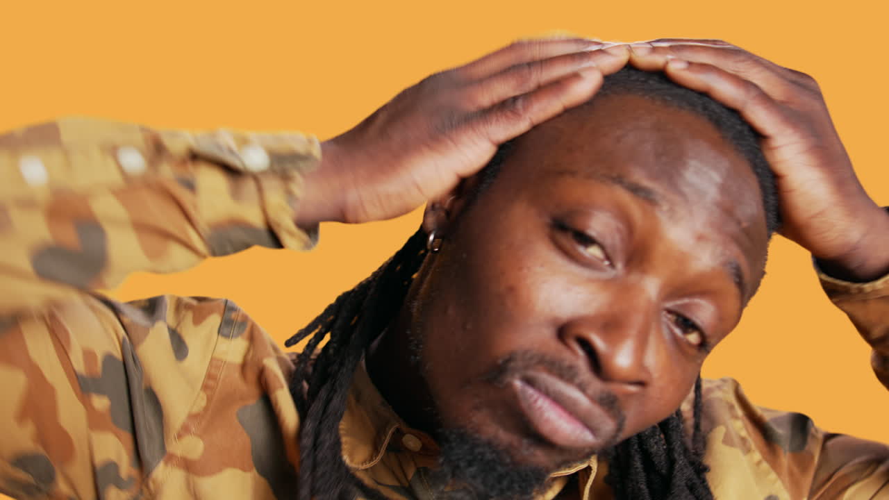 POV of african american man checking his reflection in the mirror