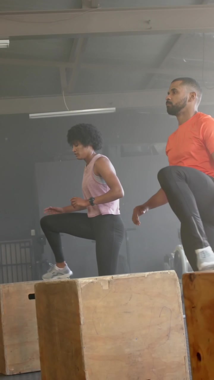 Animation of social media notifications over diverse group training on boxes at gym