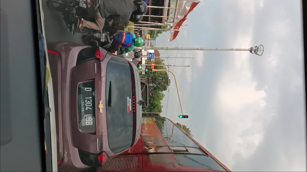 Road Traffic atmosphere in downtown Bandung, Indonesia. vertical shot.