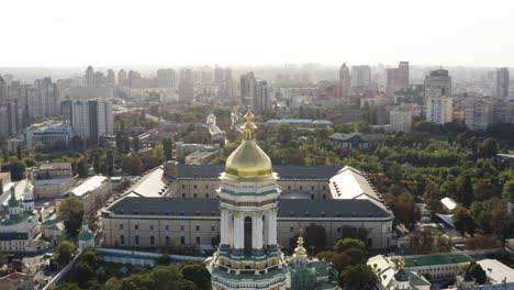 great lavra bell tower of the ancient cave monastery of kiev pechersk lavra with cityscape background, kyiv, ukraine - aerial shot