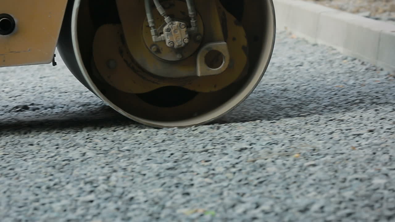 Road Roller On The Road Construction. Road roller on the road construction laying gravel