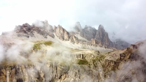 Mysterious-fog-above-rocky-high-mountain-peaks,-Dolomites-Italy