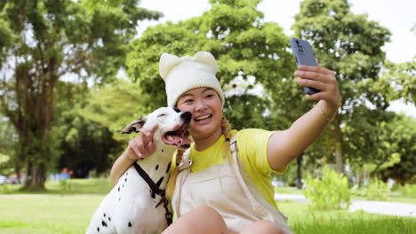 woman taking selfies with dog