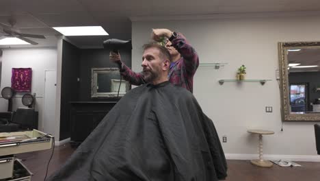 Hair-Dresser-With-Pink-Hair-Blow-Drying-Male-Client-Hair,-First-Person-View,-Static