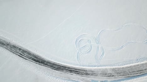 tire tracks on frozen lake