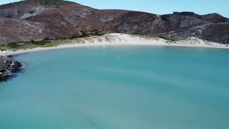 Aerial-panorama-view-of-Playa-Balandra-beach-with-calm-turquoise-waters-and-white-sand-in-Baja-California-Sur,-La-Paz,-Mexico