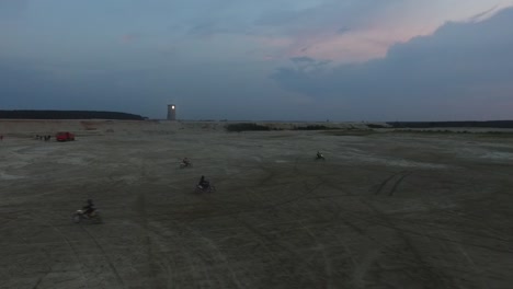 aerial view of dirt bike riders in a desert landscape