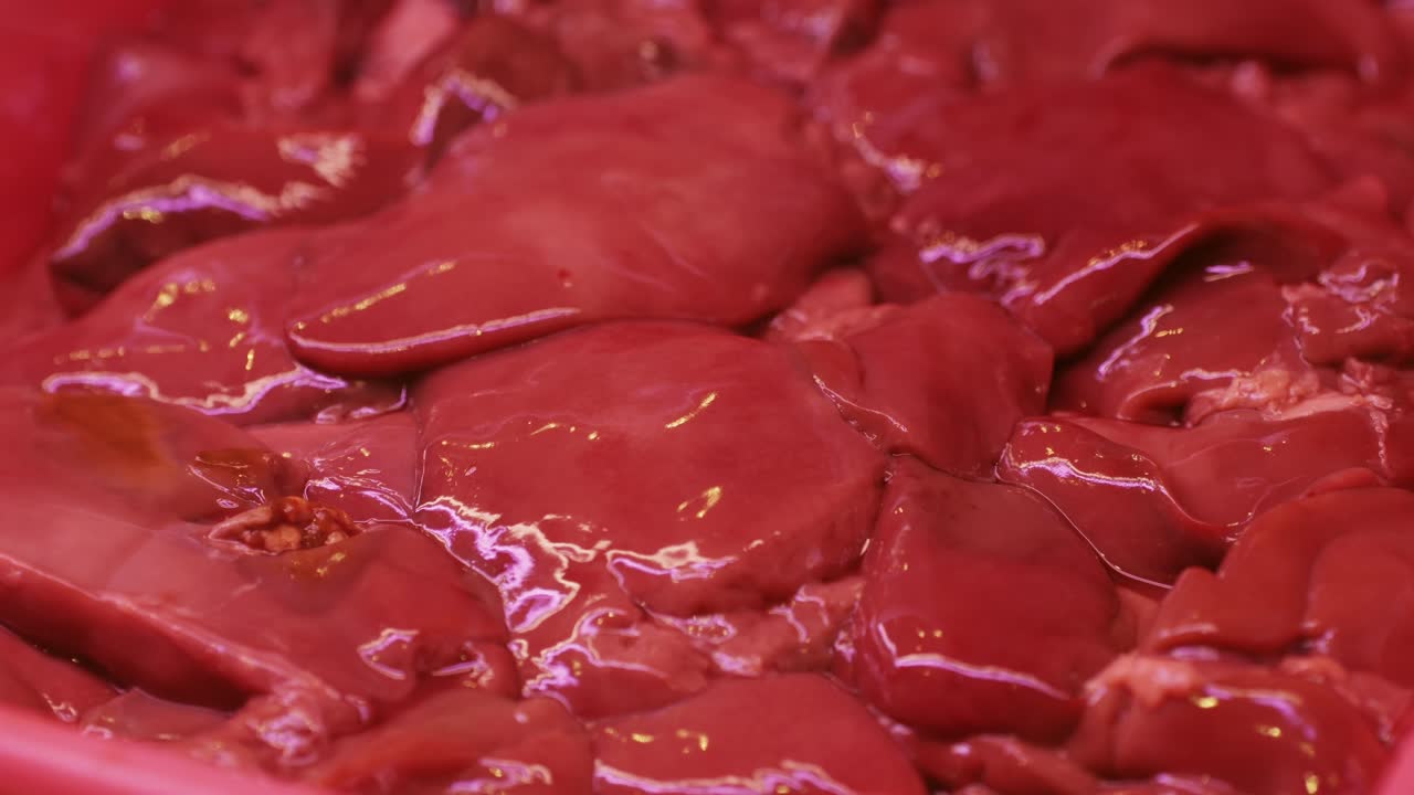 Closeup images display fresh raw liver pieces in vibrant red color, perfect for cooking and nourishing meals