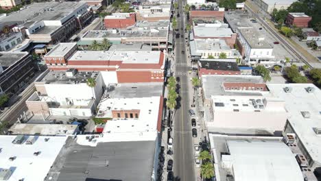 Slow-aerial-down-the-start-of-East-7th-Avenue-in-Ybor-City,-Tampa,-Florida