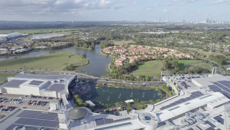 view above the robina town centre in gold coast, queensland with solar panels on rooftop for sustainability