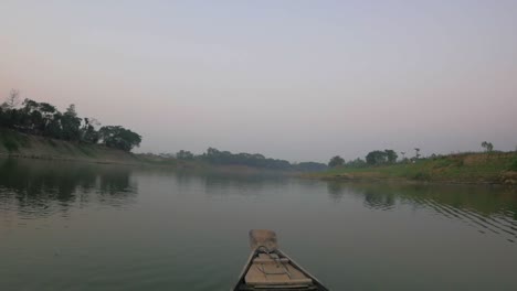 bow of a small boat as it transported a small group of people from one side of a river to the other.
