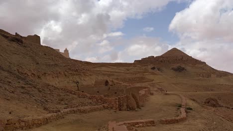 Panoramic-view-of-Ksar-Guermessa-troglodyte-village-in-Tunisia-on-cloudy-day