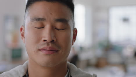 portrait-young-asian-businessman-student-smiling-happy-proud-entrepreneur-enjoying-successful-startup-company-in-office-workspace