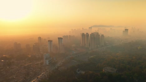 mumbai city sunrise with fog and pollution