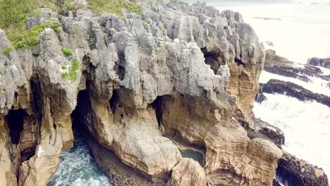 drone view of the pancake rocks at dolomite point, punakaiki, new zealand