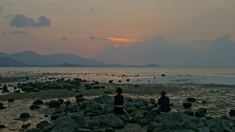 sunset view from the coast with people watching