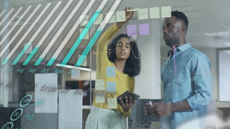 Animation of financial data processing over diverse business people in office