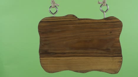 panorama, of a hanging wooden sign. isolated on green screen.