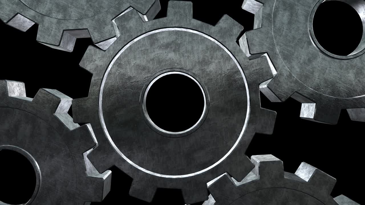 cinco engranajes girando moscas. fondo negro. primer plano. canal alfa