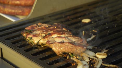 delicious steak grilling over fire during barbecue