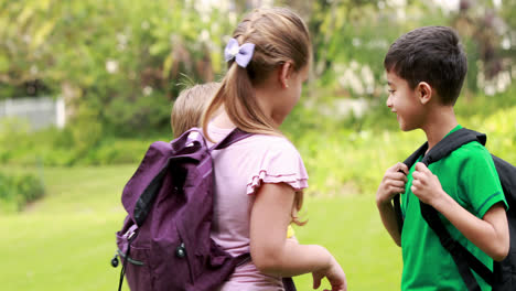 smiling pupils discussing together