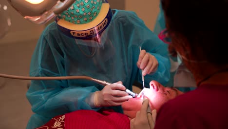 dentist examining patient's teeth