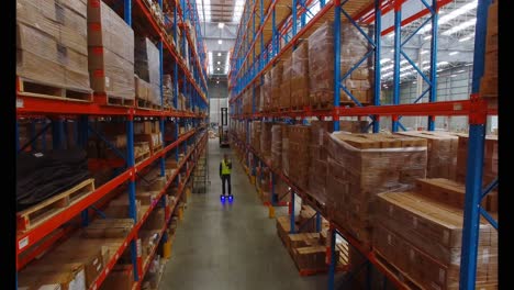 warehouse worker on hoverboard at warehouse