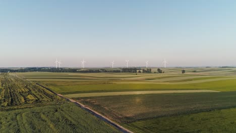 drone view of wind turbines on the agricultural field