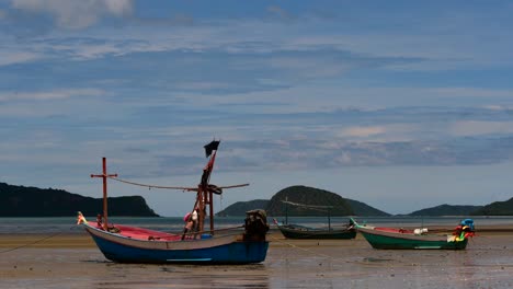 Fishing-Boats-mooring-in-low-tide-are-usually-seen-as-part-of-a-romantic-provincial-seascape-of-Khao-Sam-Roi-Yot-National-Park,-Prachuap-Khiri-Khan,-in-Thailand