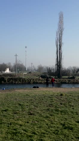 People fishing by the river