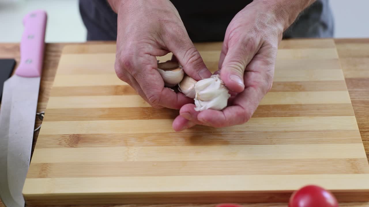 Preparing Garlic on a Cutting Board