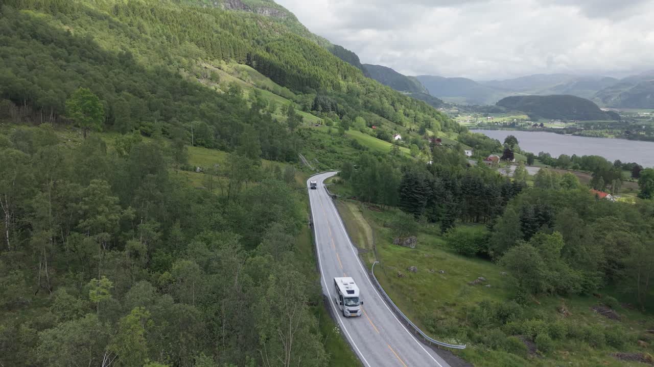 Motor Home And Bus Driving On The Mountain Road With Ardalsfjorden in Ardal, Vestland, Norway. - aerial shot