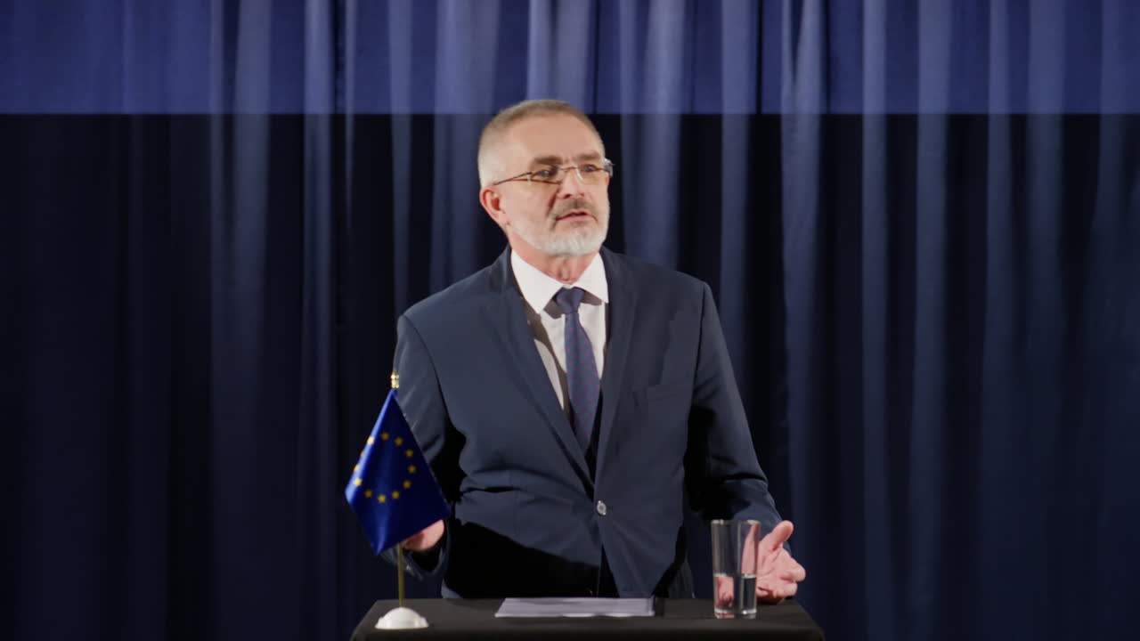 EU Politician Making Announcement at Press Conference