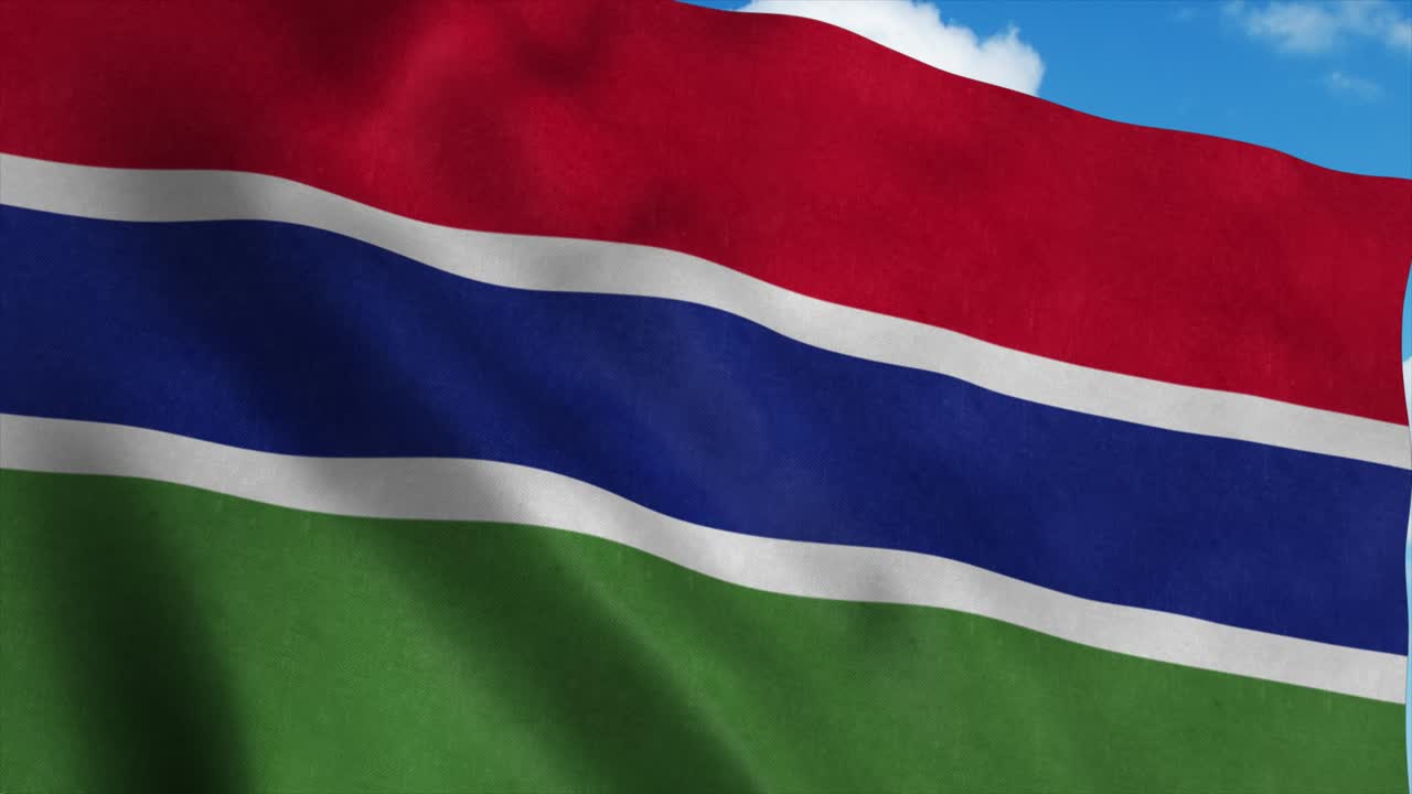 Gambia flag waving in the wind, blue sky background. 4K